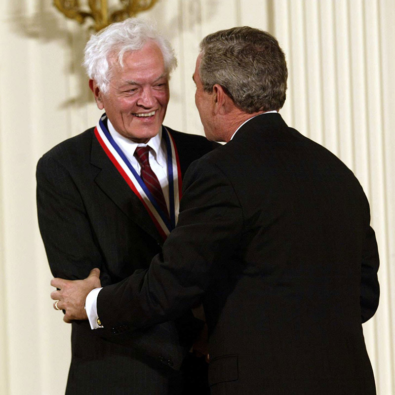 President George Bush congratulates James Glimm as he is awarded the National Medal of Honor in 2002